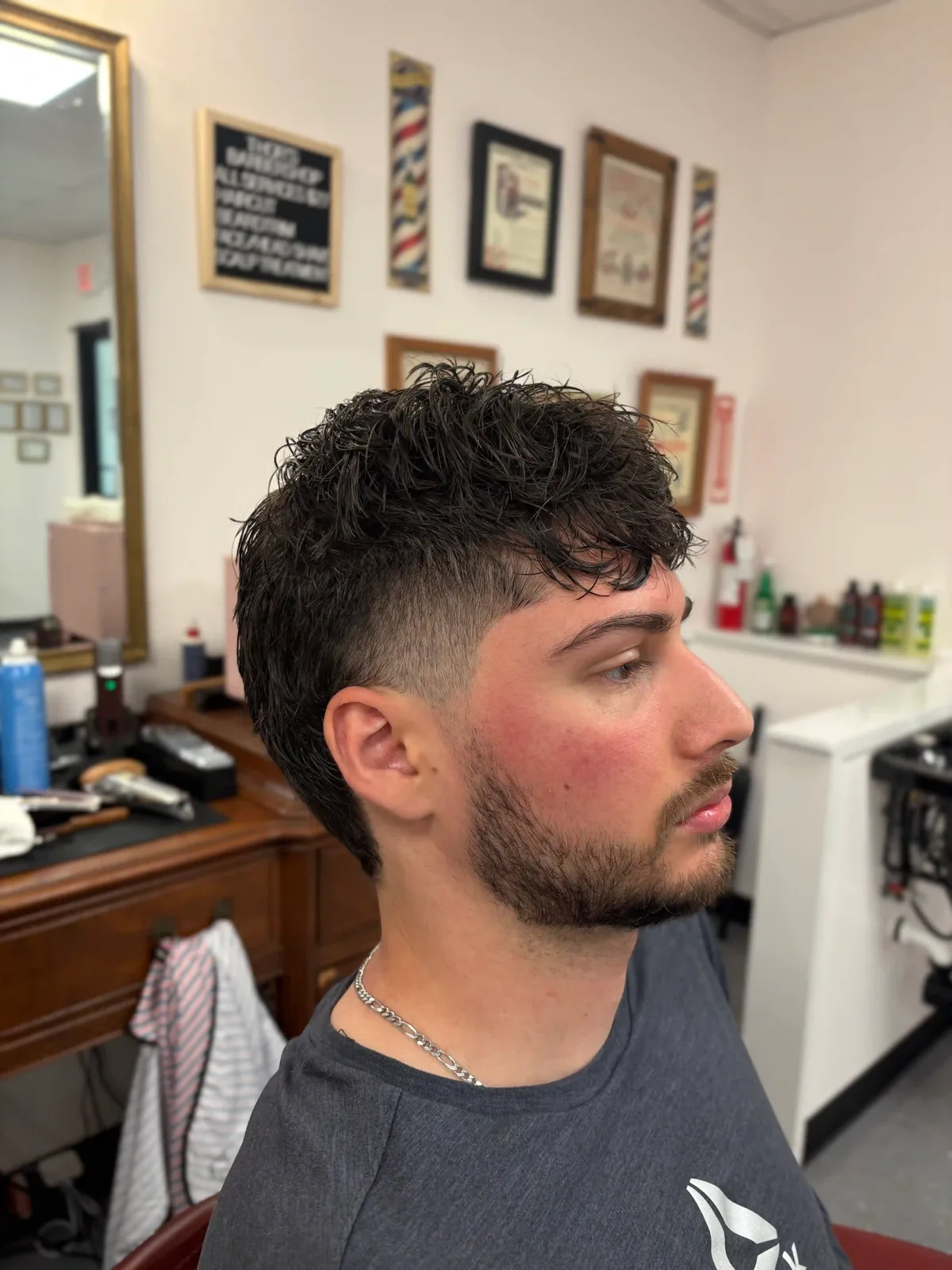 Modern mullet with burst taper fade at Thor's Barbershop